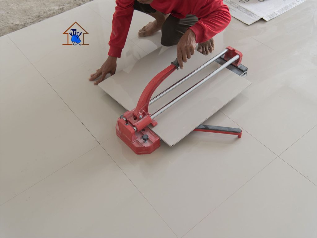 “Gaben Technologies tiler cutting floor tiles for precise installation in a Ghanaian home”