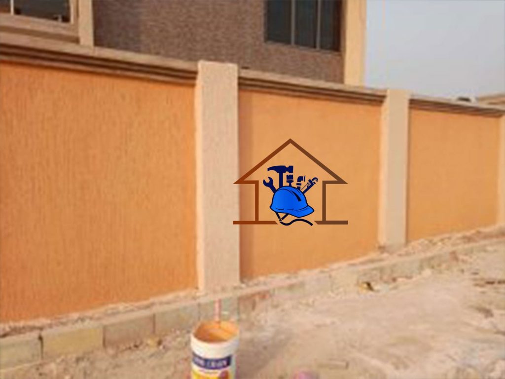 “Stylish boundary wall with orange Graffiato texture applied by Gaben Technologies in Accra, Ghana”